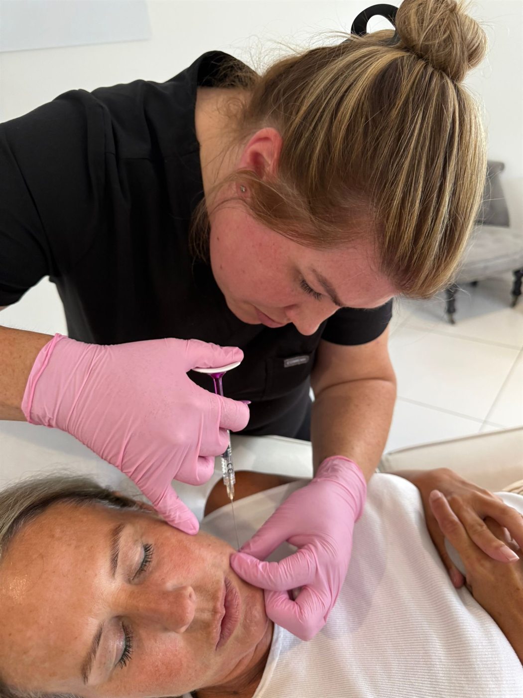 Stacey treating a patient in her Nuneaton clinic